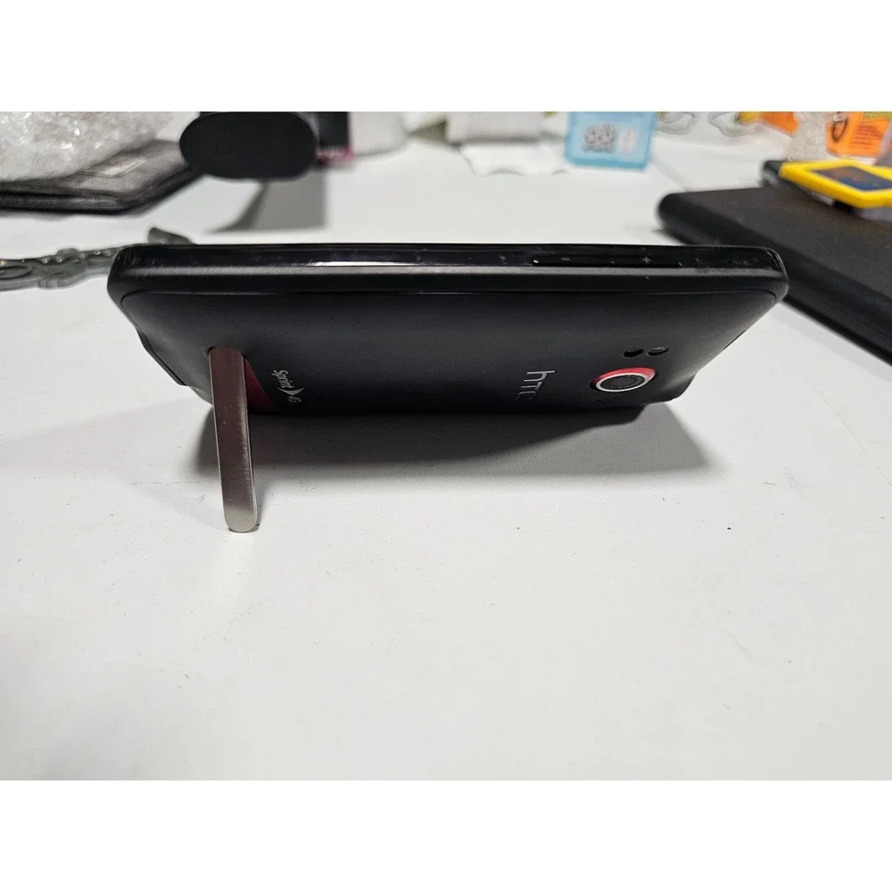 vintage HTC Evo 4G smartphone for the Sprint network stand y2k